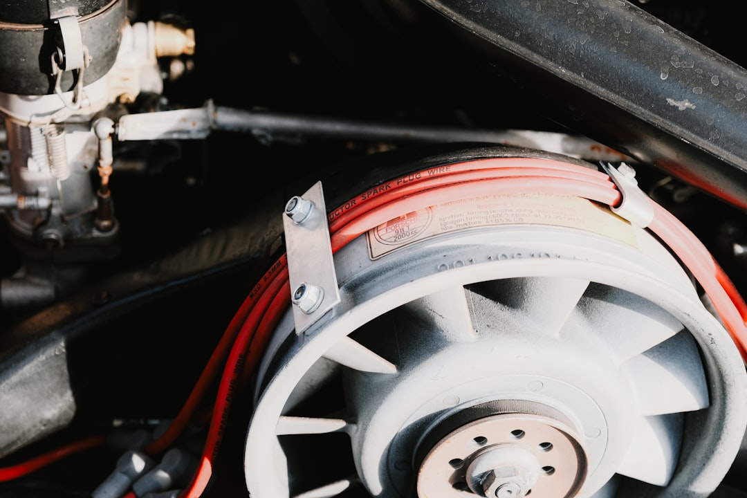 Close-up of a car engine bay showing the area near the radiator and cooling fan at the front of the vehicle