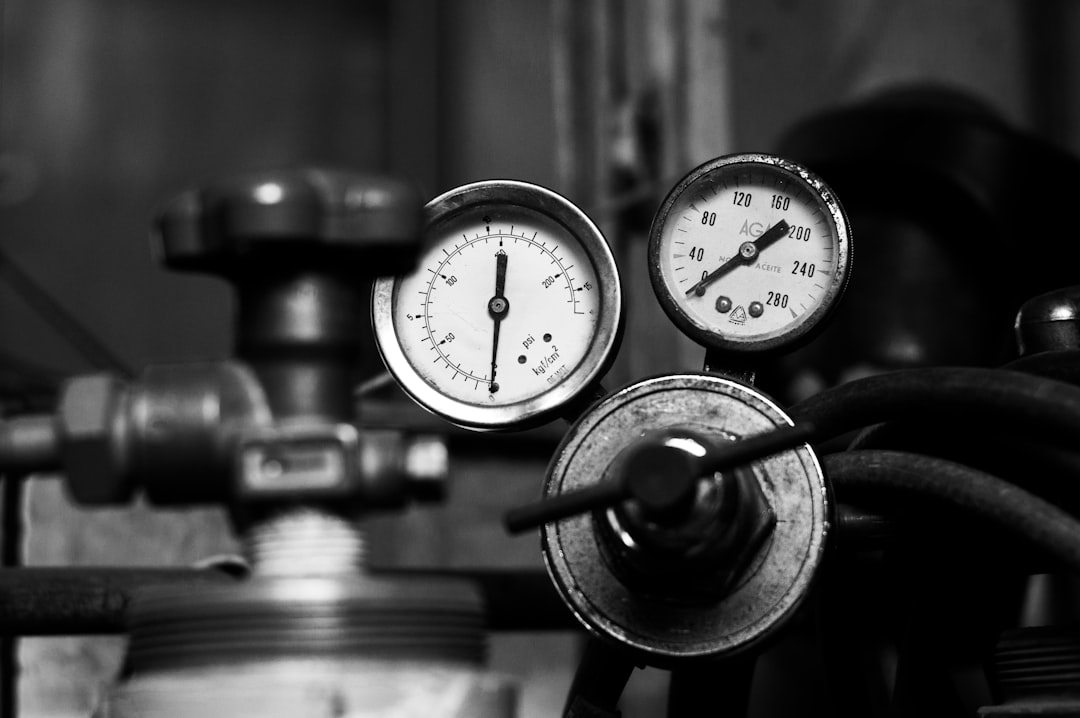 Close-up of pressure gauges used by technicians to diagnose automotive air conditioning systems